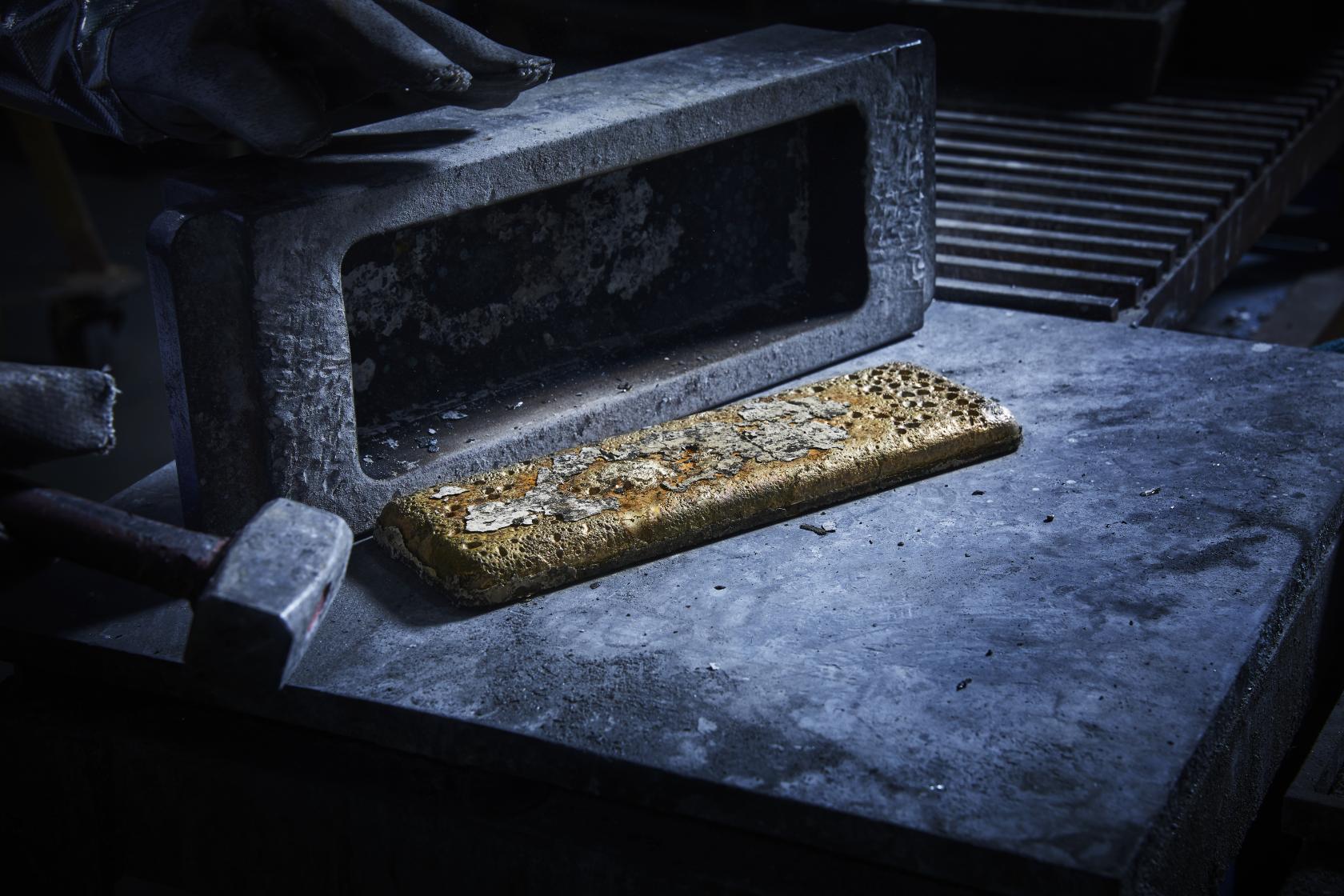 Gold bar freshly cast in mould